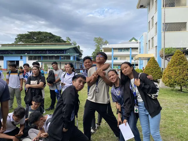 BSIT students gathered outdoors on campus for a meeting