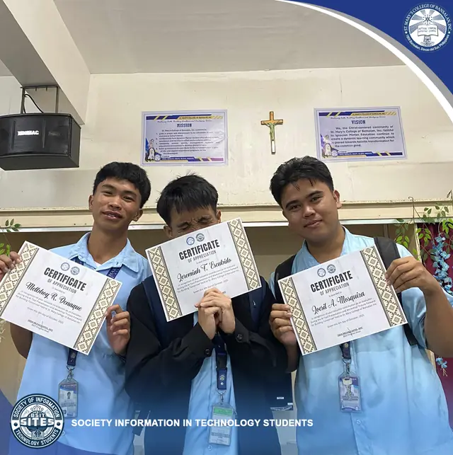 Classmates holding certificates at an awarding