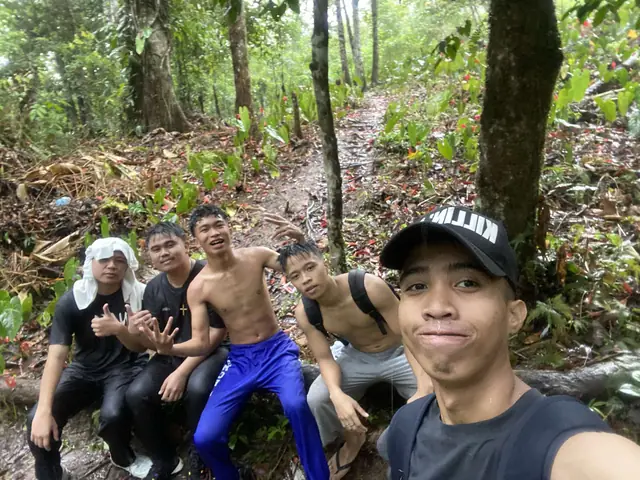 Hiking with friends on a trail to a waterfall